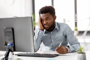 Business owner looking at business financials undergo asset impairment testing