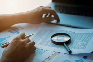 Better business understanding is why financial literacy matters to this small business owner who examines accounting documents.