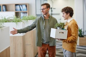 A business manager welcomes a new employee. Representing the cost to hire a new employee.